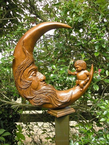 My mother's maiden name was Moon. I carved this after she died as she was a Moon baby. This carving is half way up the side border by the field.