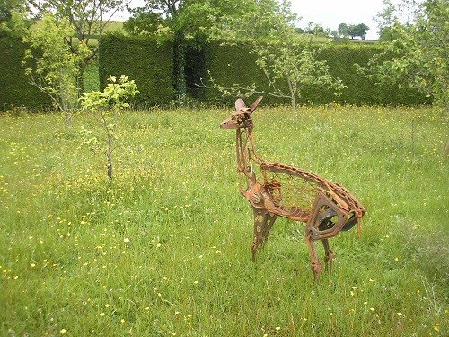 Rusty deer sculpture.